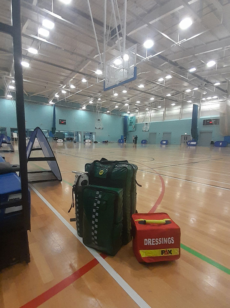 paramedic equipment on the floor of a sports hall