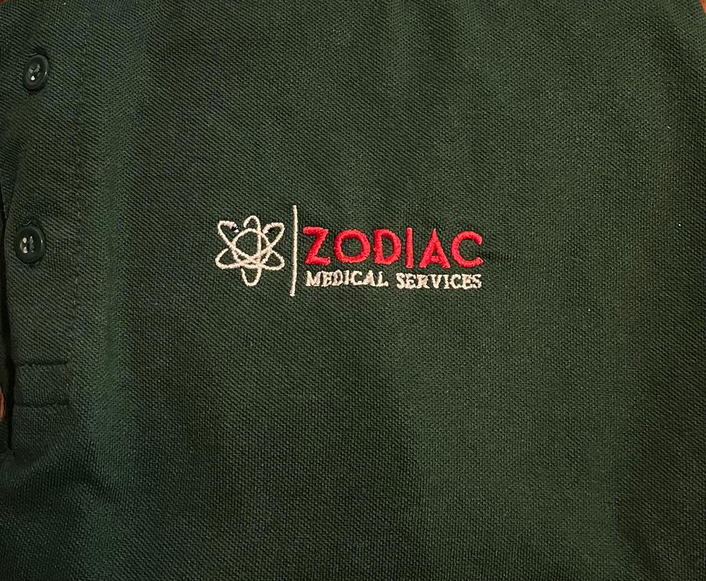 Zodiac Medical Services logo on a polo shirt
